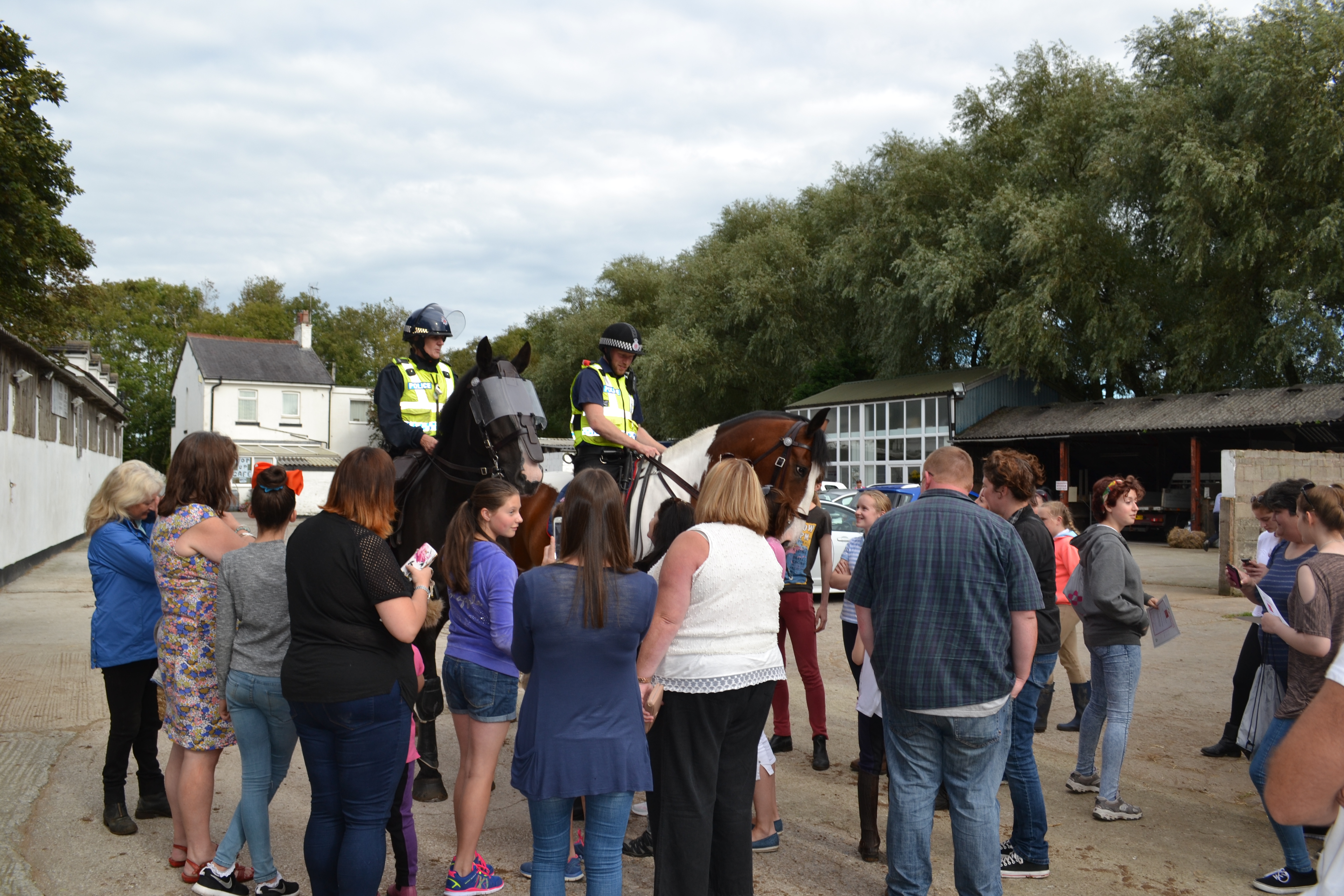 Customers meeting the Lancashire mounted police horses at Midgeland Riding 