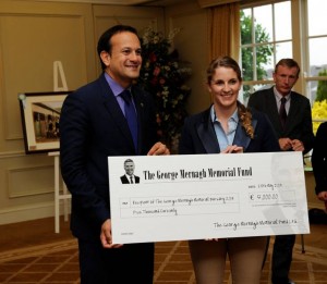 Emma Cahill receiving her bursary from Leo Varadkar, then Minister for Tourism & Sport. Currently Minister for Health.