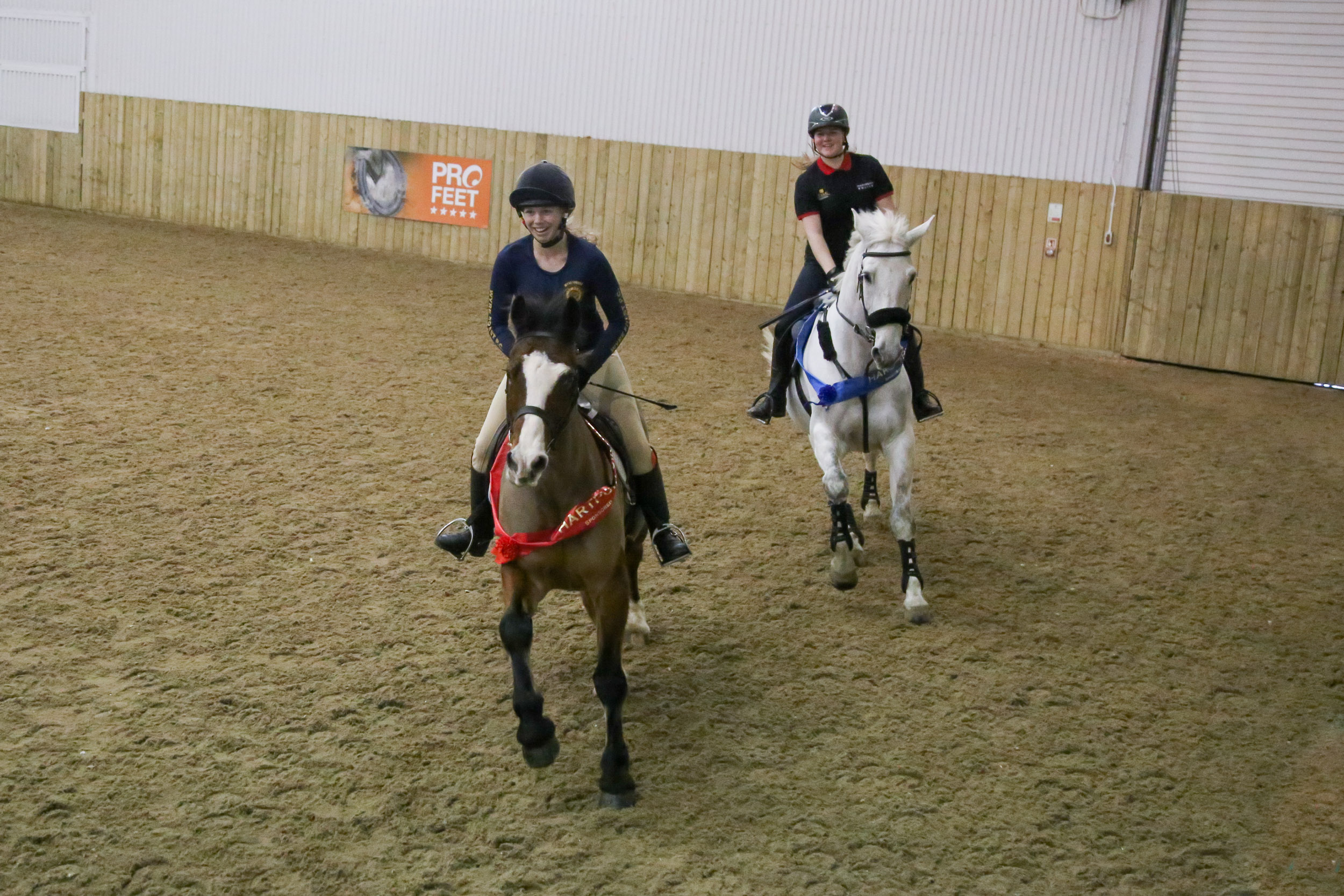 Equine students Isabel Benbow (riding Bryn) and Sophie Cork (riding Turbo)