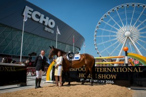 Olympic Gold Medalist Peter Charles and show president Nina Barbour pose with Douglas Delight  in front of the Echo Arena, Liverpool at the launch of the inaugural Liverpool International Horse Show to take place 1-3 January 2016 - Echo Arena, Liverpool, United Kingdom - 11 June 2015