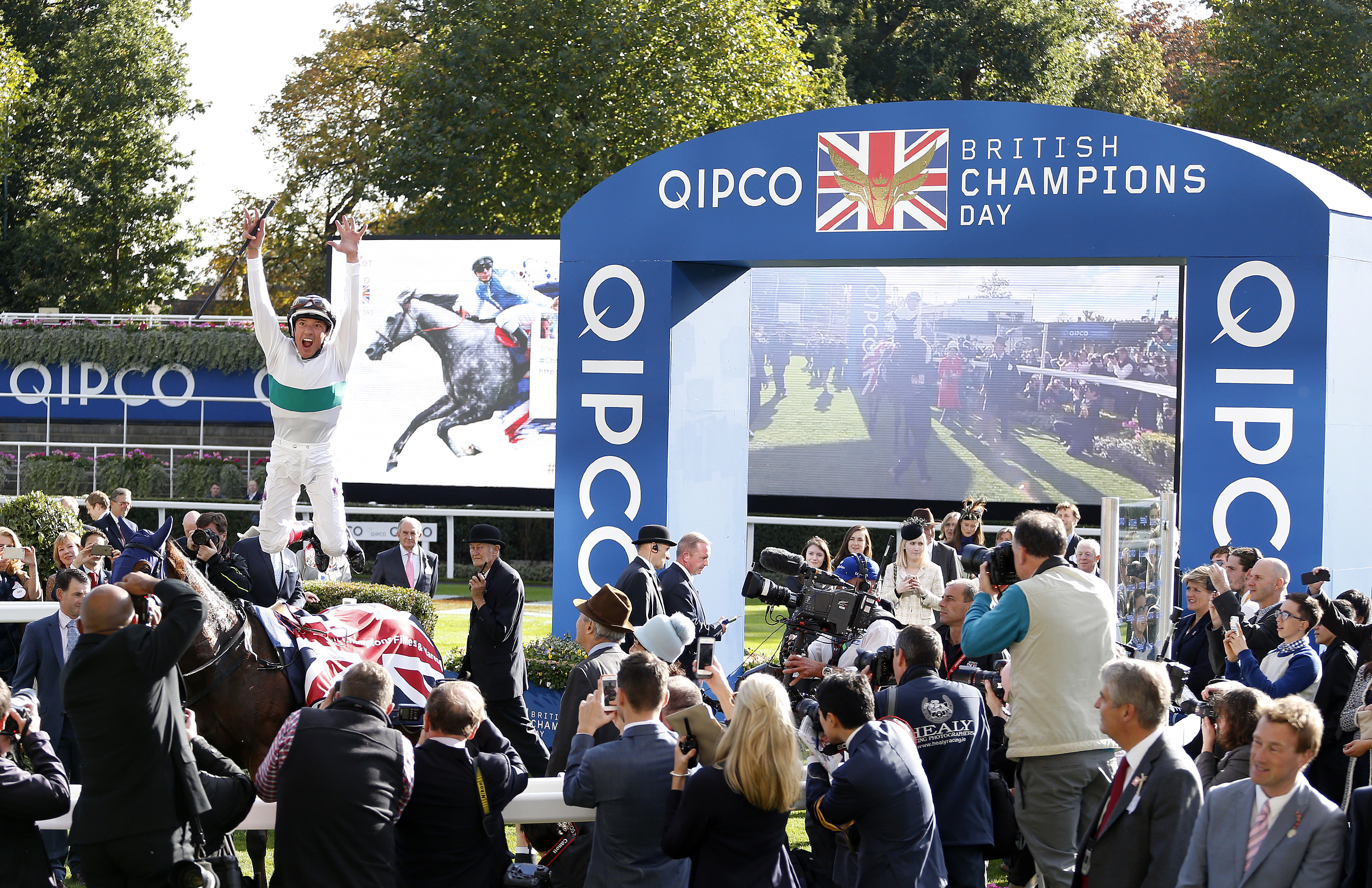 Frankie Dettori leaps from Journey after winning The Qipco British Champions Fillies Mares Stakes at Ascot Racecourse © Alan Crowhurst/Getty Images