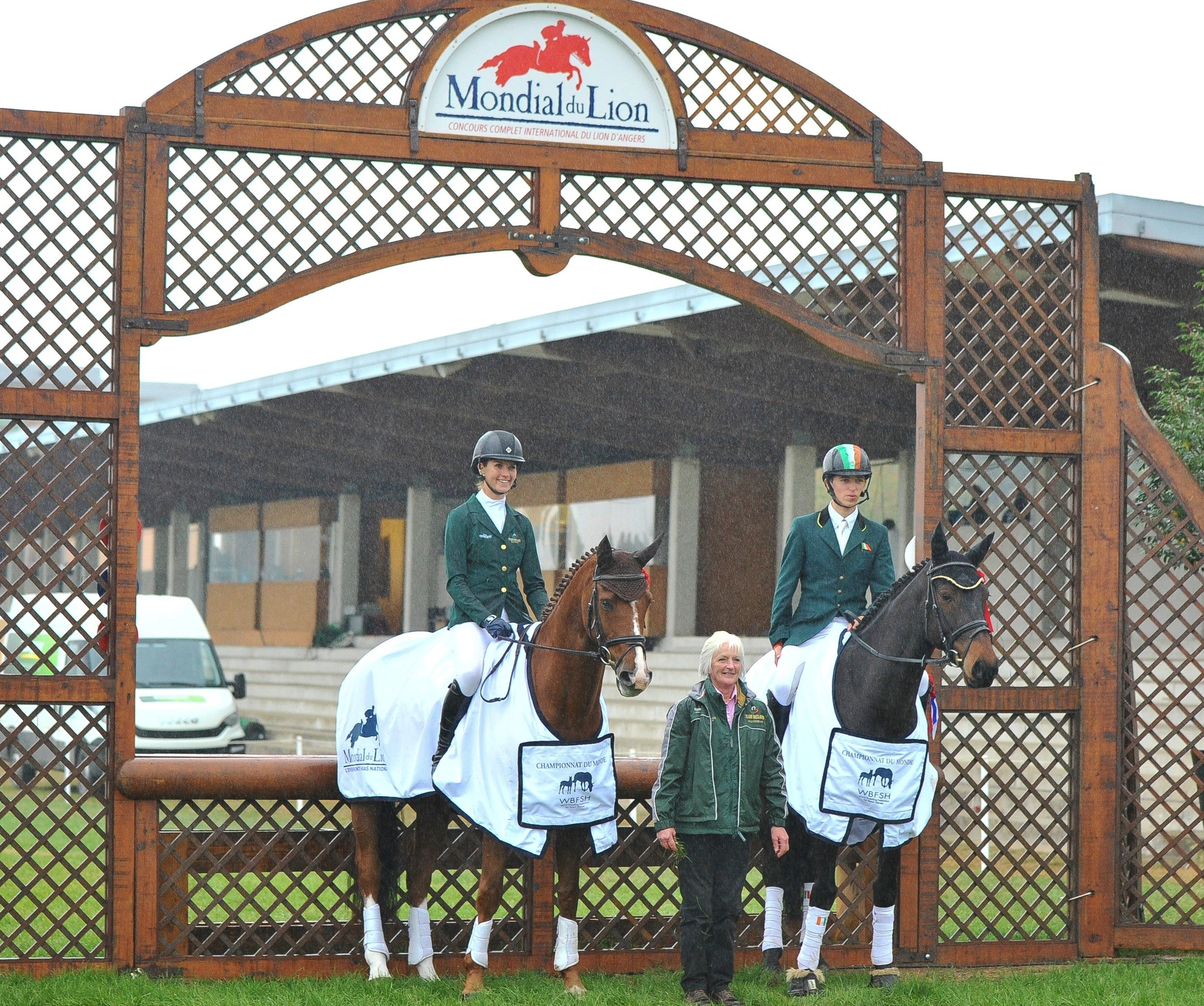 The highest placed Irish Sport Horses in the six and seven-year-old final, Sophie Richards with Business Class (ISH), and Cathal Daniels with Sammy Davis Jnr. (ISH) pictured with Chef d'Equipe Janet Murray at Le Lion in France © Louise O'Brien